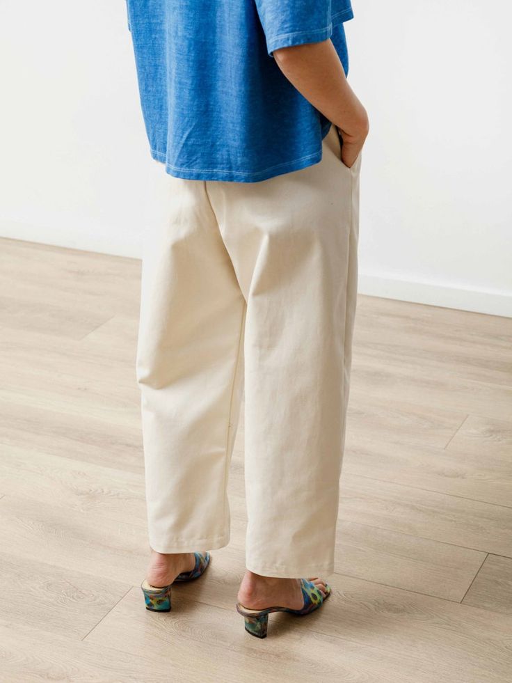 Beige Tapered Leg Pants For Everyday, Everyday Beige Tapered Leg Pants, Beige Cotton Cropped Wide Leg Pants, Beige Cropped Leg Wide Pants In Cotton, Beige Cropped Wide Leg Cotton Pants, Everyday Cream Tapered Leg Bottoms, Everyday Cream Pants With Pockets, Tapered Beige Cotton Pants, Cream Tapered Leg Pants For Everyday