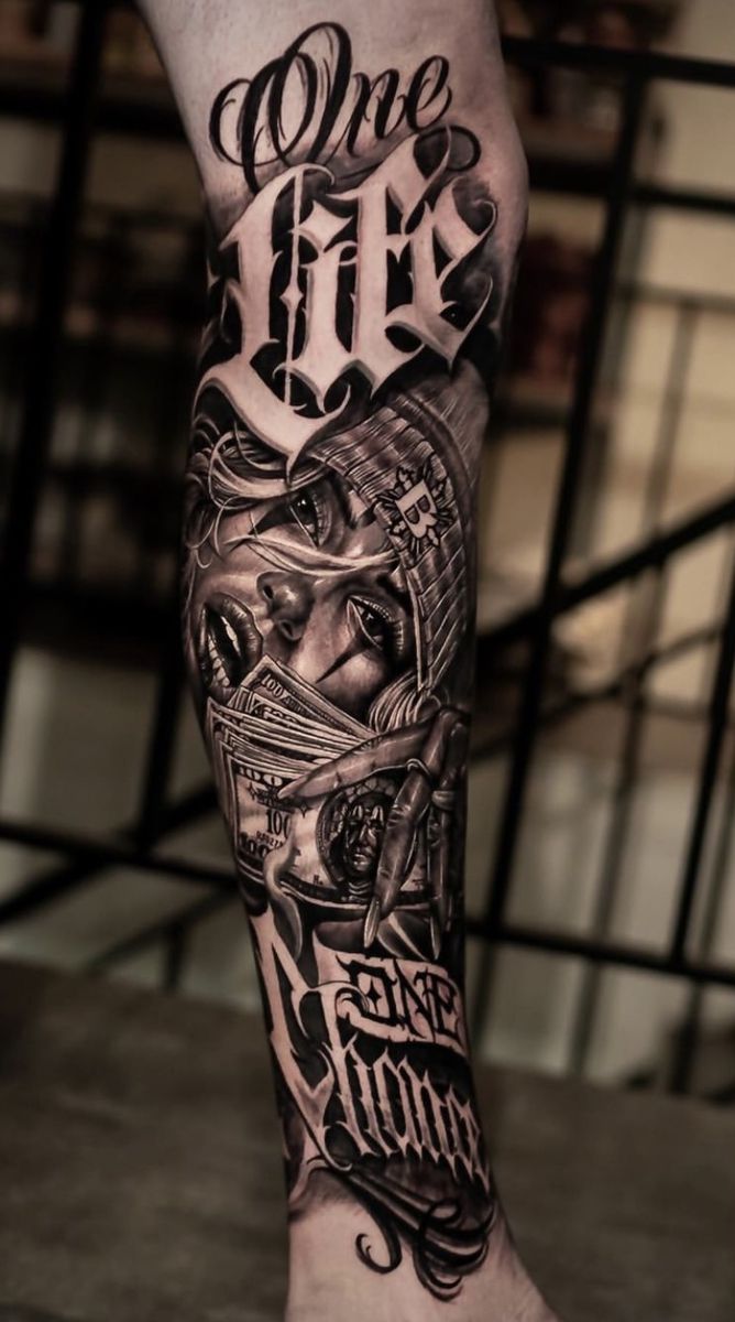 a man's leg with an old school style tattoo design on it, and the words one day written in black ink