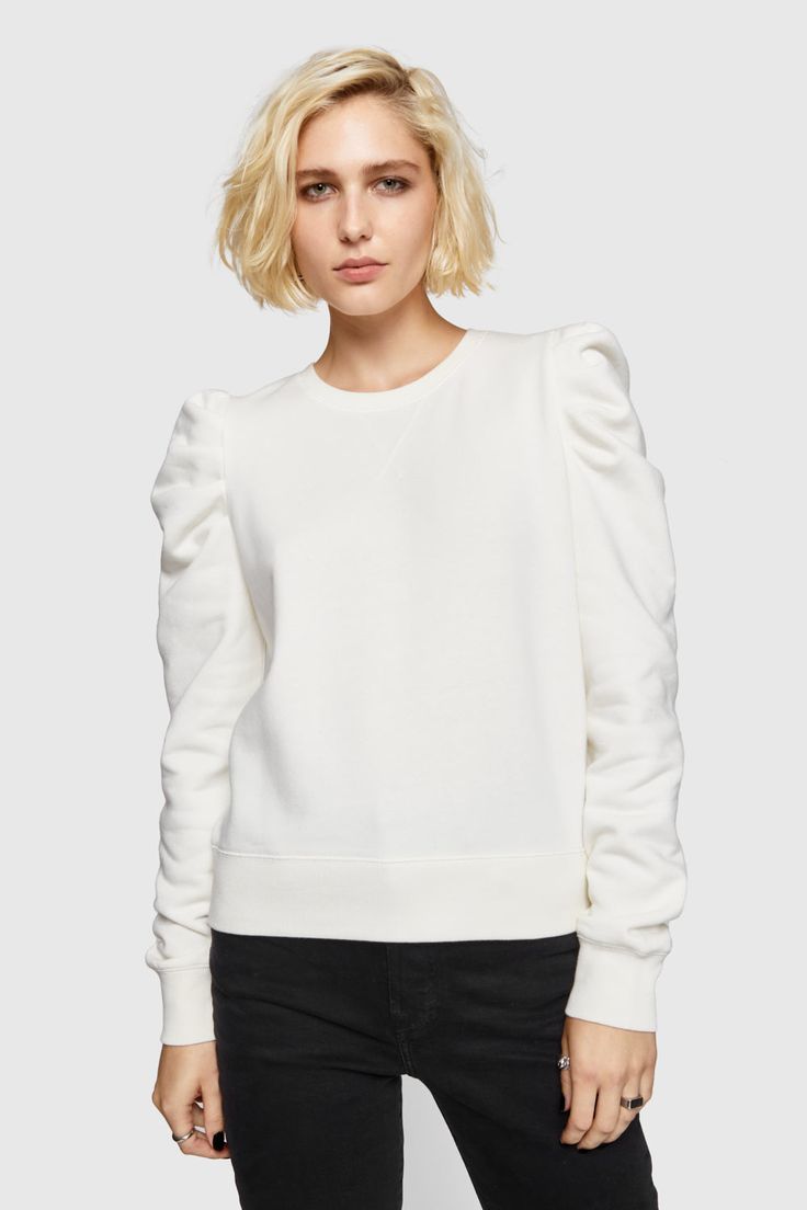 Our best-selling Janine Sweatshirt has a subtle feminine feel thanks to its low-key statement ruffled sleeves. We love wearing this casual-cool top with everything from jeans to leather skirts. | Rebecca Minkoff Janine Sweatshirt In White - Size XS Skirts Style, Ruffle Sleeve Sweater, Leather Skirts, Leather Outerwear, Sweater White, Leather Dresses, Ruffled Sleeves, Sweater Sleeves, White Sweatshirt