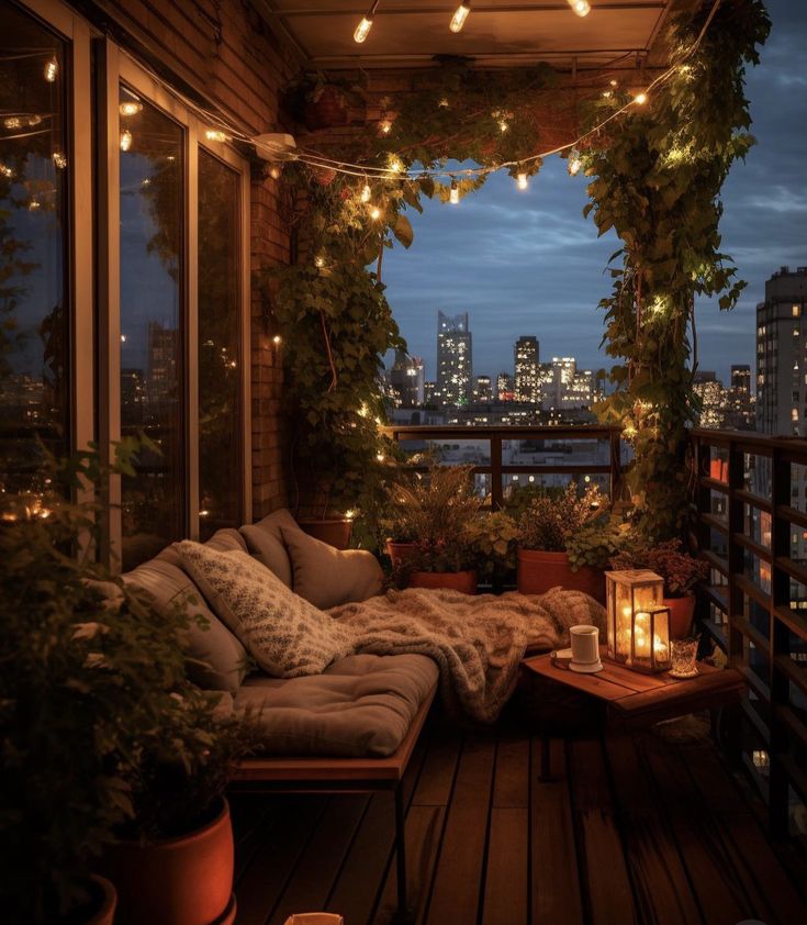 a balcony with lights strung from the ceiling and plants growing on the wall, next to a couch