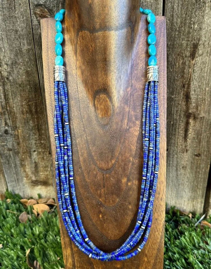 Add a touch of Southwestern flavor to your jewelry collection with this beautiful beaded necklace. Made of .925 sterling silver, this 28-inch necklace features multiple strands of stunning lapis and turquoise beads. The intricate beading and vibrant blue colors make this piece a true statement accessory. Perfect for any occasion, this necklace is a must-have for any jewelry lover. Its unique design and high-quality materials ensure that it will be a cherished piece in your collection for years to come. Don't miss out on the chance to add this beautiful beaded necklace to your wardrobe today! Sterling Silver Beaded Multi-strand Jewelry, Multi-strand Beaded Sterling Silver Necklace, Southwestern Sterling Silver Beaded Necklaces, Southwestern Multi-strand Turquoise Beaded Necklace, Artisan Blue Jewelry With Colorful Beads, Blue Artisan Jewelry With Colorful Beads, Southwestern Multi-strand Turquoise Gemstone Necklace, Hand-strung Blue Sterling Silver Jewelry, Bohemian Hand-strung Lapis Lazuli Jewelry