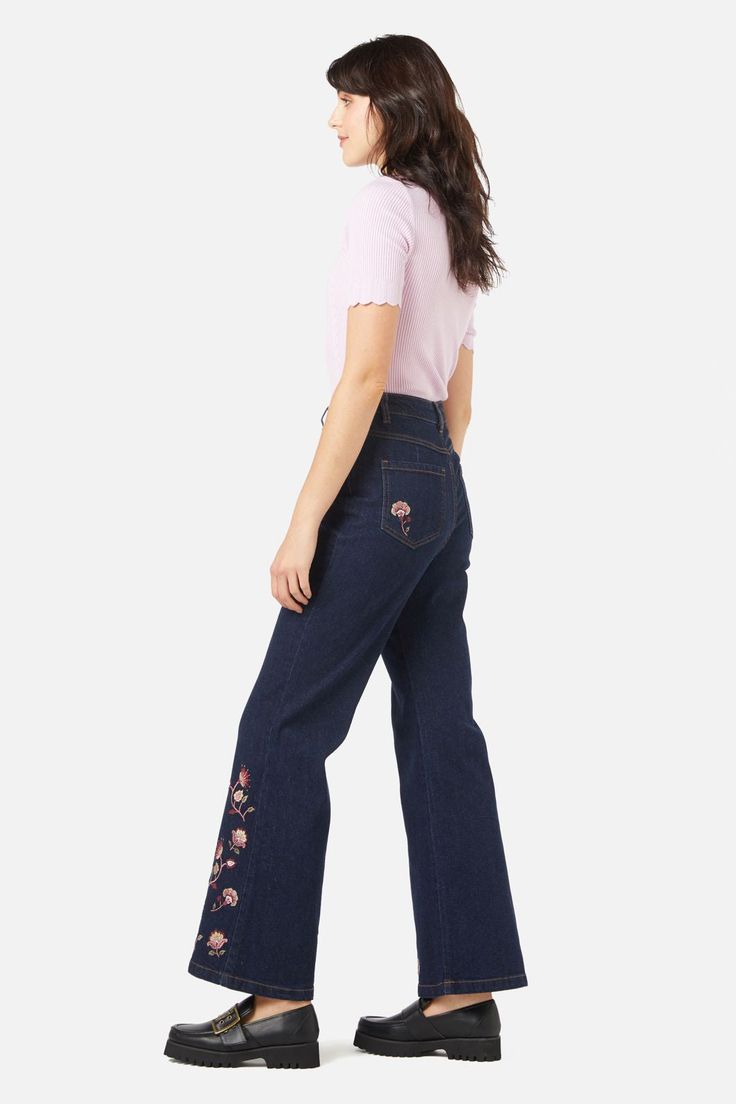 Paisley embroidered flare jean- ornamental paisley swirls embroidered on leg hem and back pockets- a trendy flare fit for this season in a rich dark denim- high rise style- front fly with button closure- side and back pockets- comfortable cotton elastane blend- available in dark denim Product Code: PGFX017