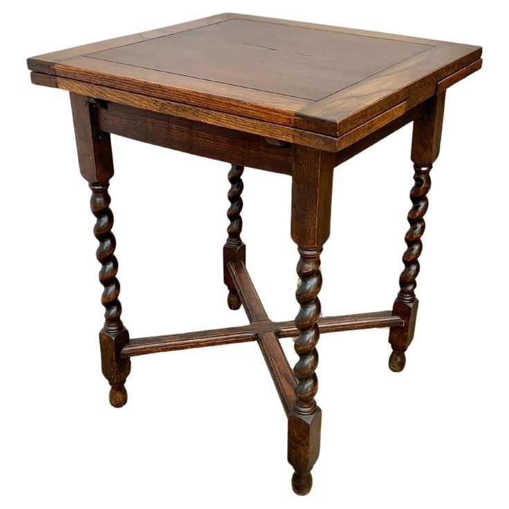 an old wooden table with two legs and a square top on the bottom is turned upside down