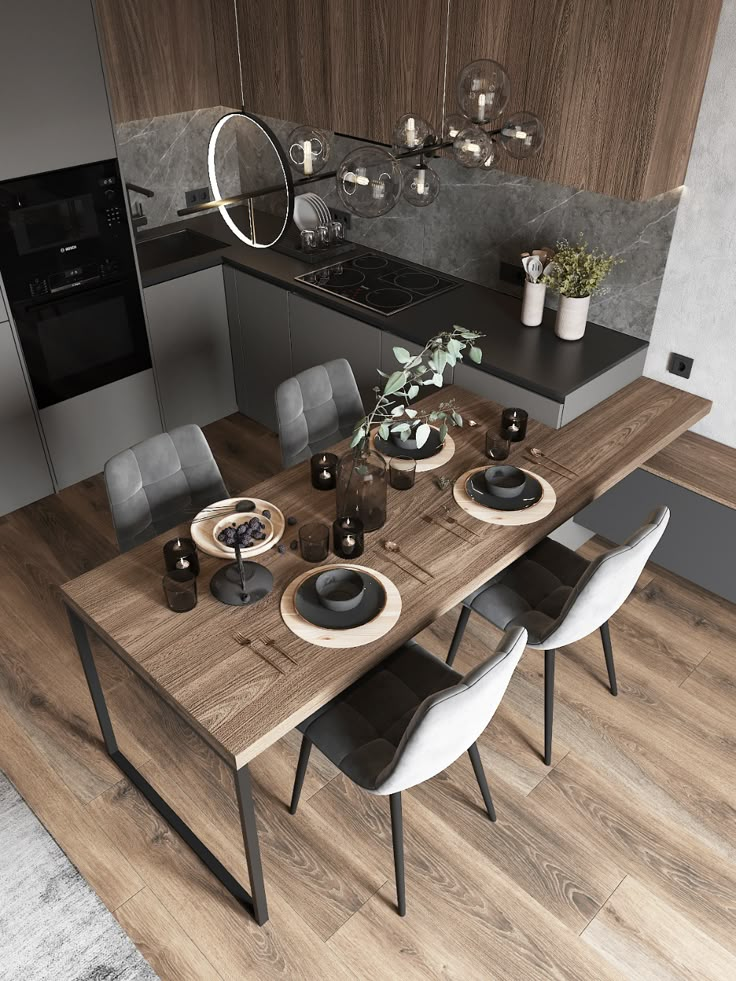 a dining table with chairs and plates on it in the middle of a wooden floor