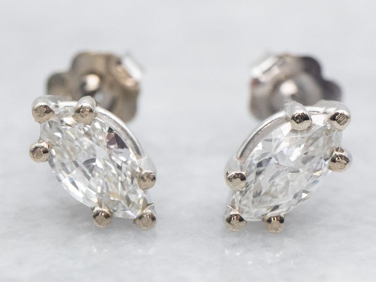 These marquise-cut diamond stud earrings have classic post-back findings that keep them secure and comfortable when worn. The diamonds themselves are full of fire and sparkle with excellent clarity. Crafted of 14-karat white gold, these earrings are a wardrobe staple! Metal: 14K White GoldGem: 2 Diamonds totaling .88 Carats, VS in Clarity, I in ColorGem Measurements: 4.0 x 7.5 mm, Marquise Cut White Gold Marquise Diamond Earrings, Marquise Diamond Earrings In White Gold, White Gold Diamond Earrings Marquise Cut, Brilliant Cut Marquise Diamond Earrings For Formal Occasions, Classic Diamond Earrings With Diamond Eyes For Formal Occasions, Formal White Marquise Cut Diamond Earrings, Classic Marquise Diamond White Earrings, Classic White Gold Marquise Cut Diamond Earrings, Diamond White Marquise Diamond Earrings With Diamond Accents