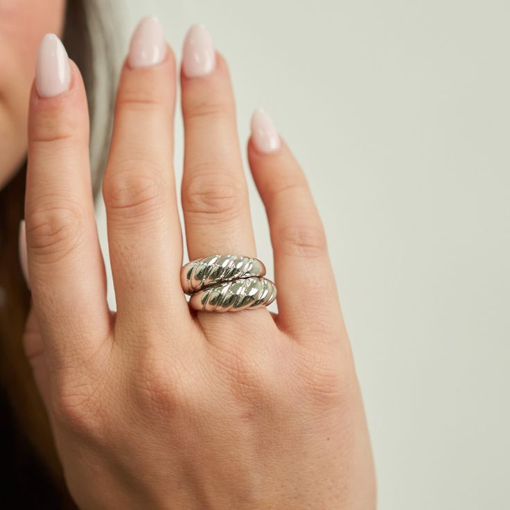 PRODUCT DETAILS Waterproof💧💧💧 Stainless Steel White Rhodium Hypoallergenic Nickel Free DESIGNER NOTE Discover the exquisite craftsmanship of our Braided Ring, a silver masterpiece that weaves together elegance and artistry. This ring's intricate braided design creates a striking visual texture that embodies both strength and grace, making it a symbol of timeless beauty and individuality. Style Tip: Elevate your Bohemian-inspired look by wearing the Braided Ring alongside layered bracelets and Timeless Silver Dome Promise Ring, Elegant Hypoallergenic White Gold Rings, Adjustable Polished Dome Ring For Promises, Adjustable Polished Dome Ring For Promise, Adjustable Modern Jewelry With Tarnish Resistance, Modern Twist Sterling Silver Tarnish-resistant Jewelry, Silver Timeless Promise Ring, Adjustable Modern Twist Tarnish-resistant Jewelry, Timeless Silver Promise Ring