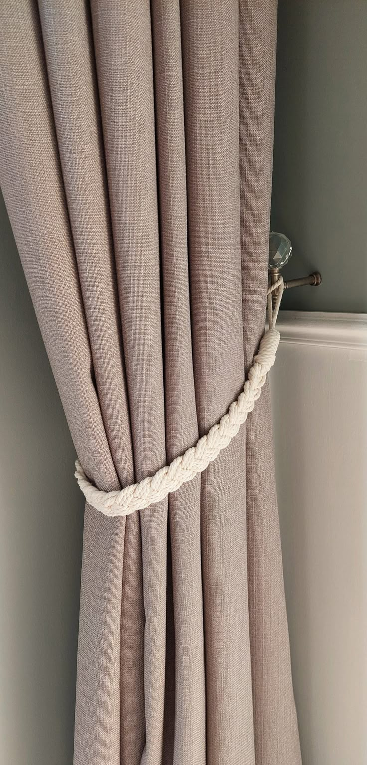 a curtain with rope hanging from it's side