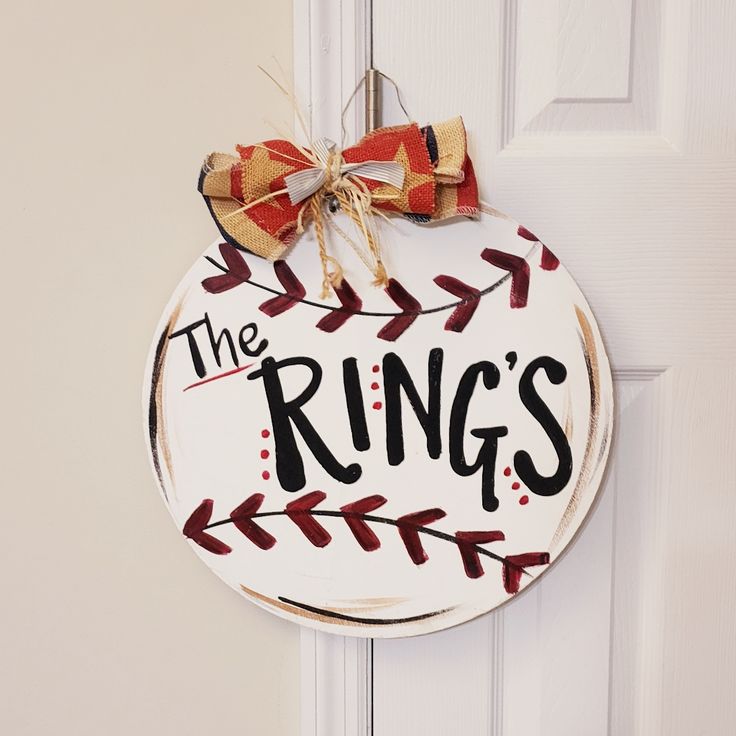 the ring's baseball door hanger is decorated with bows