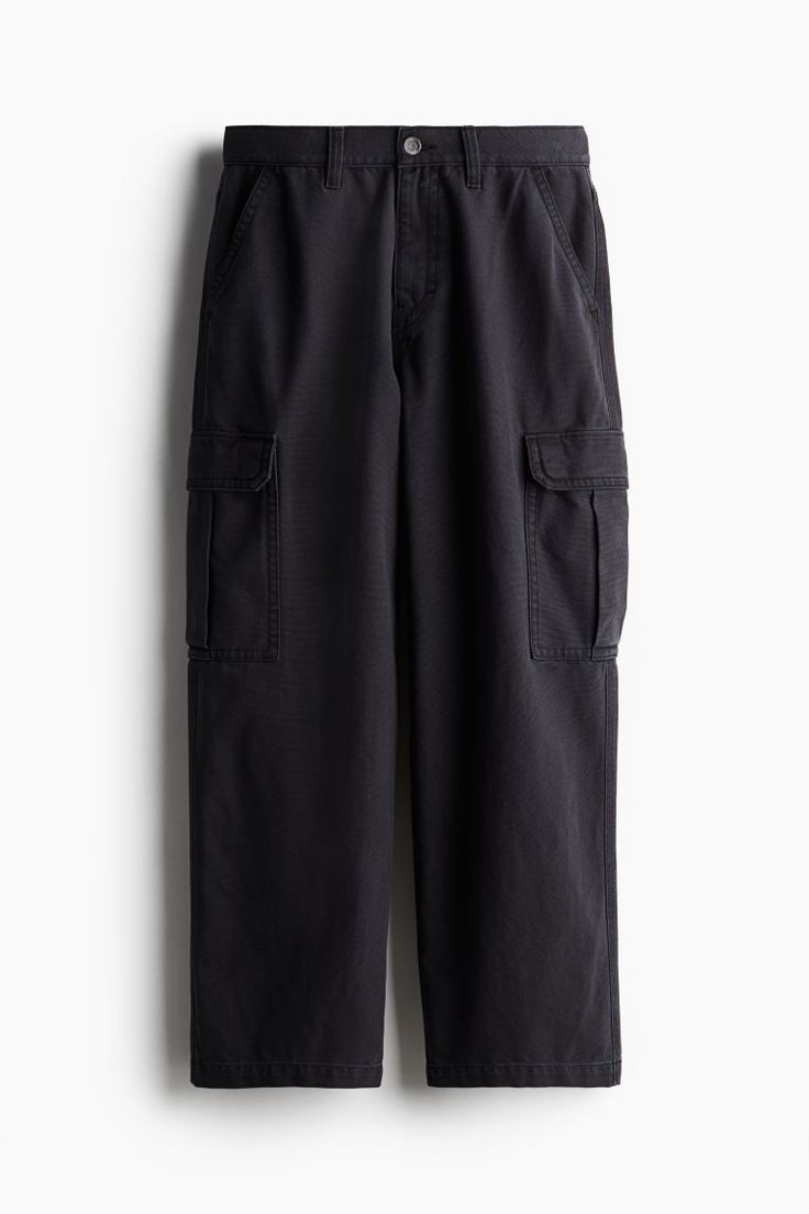 Baggy-fit cargo pants in thick cotton canvas with a casual  but not oversized silhouette. Zip fly with button  side pockets  back pockets  and bellows leg pockets with flap and snap fasteners. Cargo Pants Baggy, Fit Cargo Pants, Khaki Cargo Pants, Baggy Cargo Pants, Green Cargo Pants, Black Cargo Pants, Men Trousers, Mens Cargo, Snap Fasteners