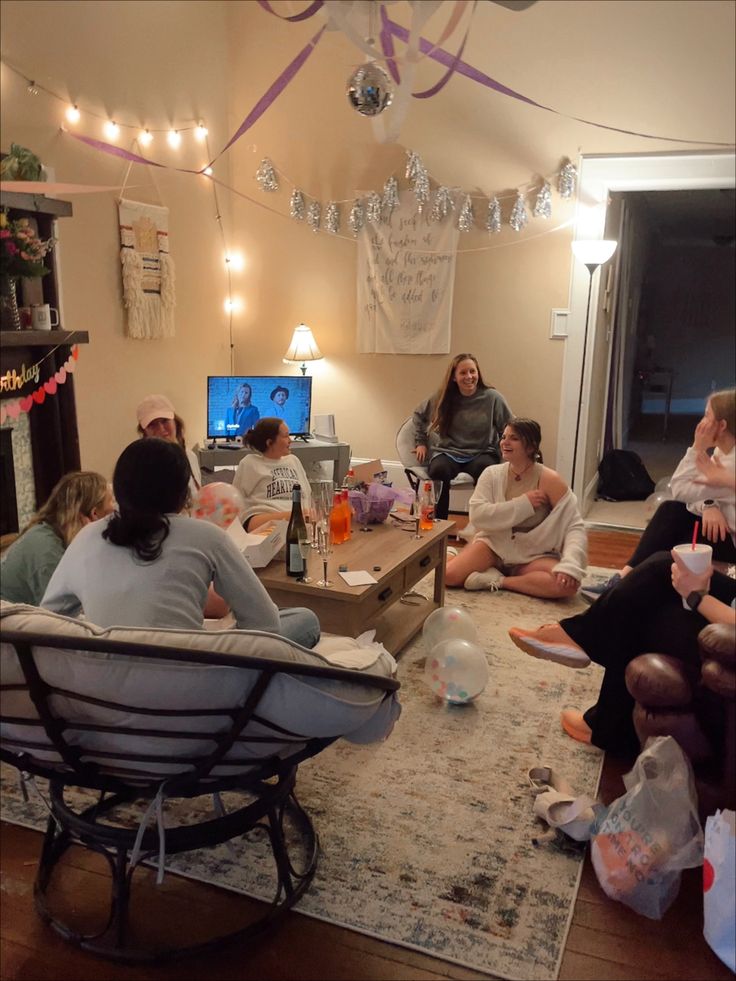 a group of people sitting around in a living room