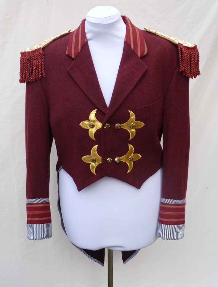 "Mens Medium , Upcycled red ringmaster , greatest showman tailcoat . Would fit a women size UK 20 ,US 16 Made from a mens ' Debenhams  ' red woollen jacket. It also has gold applique  and gold buttons.  Measures chest 116 cm (45.5 \") Waist 106 cm (41.5 \") shoulder to hem front 51.5 cm full length back 101 cm sleeve length 63 cm top sleeve width 21.5 cm shoulder seam 17.5 cm across front 43.5 cm (across back 49 cm ) all the way around armhole 56.5 cm  Can post quickly if needed by a certain dat Red Fitted Blazer For Costume Party, Fitted Red Ceremonial Outerwear, Fitted Red Outerwear For Ceremonial Occasions, Matilda Costume, Steampunk Circus, Bespoke Jacket, Ring Master, Steampunk Festival, Gold Applique