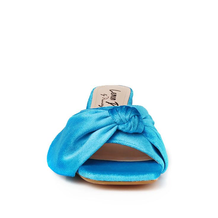 If you're looking for a touch of luxury, look no further than our Kolkata velvet slippers. With their comfortable heel, these slippers are perfect for a night on the town or a day of relaxation. Made with a beautiful velvet upper, they'll add some glamor to any outfit. The velvet upper provides a plush feel while the 2.5” block heel gives you an extra boost of lift. Plus, the slip-on design is easy to take on and off, making this ideal for any special occasion. Whether you're dressing up or dres Summer Party Fabric Heels, Fabric High Heel Party Sandals, High Heel Fabric Party Sandals, Fabric High Heel Sandals For Party, High Heel Fabric Sandals For Party, Fabric Heels For Spring Parties, Elegant Summer Fabric Heels, Chic Summer Fabric Heels, Elegant Fabric Heels For Summer