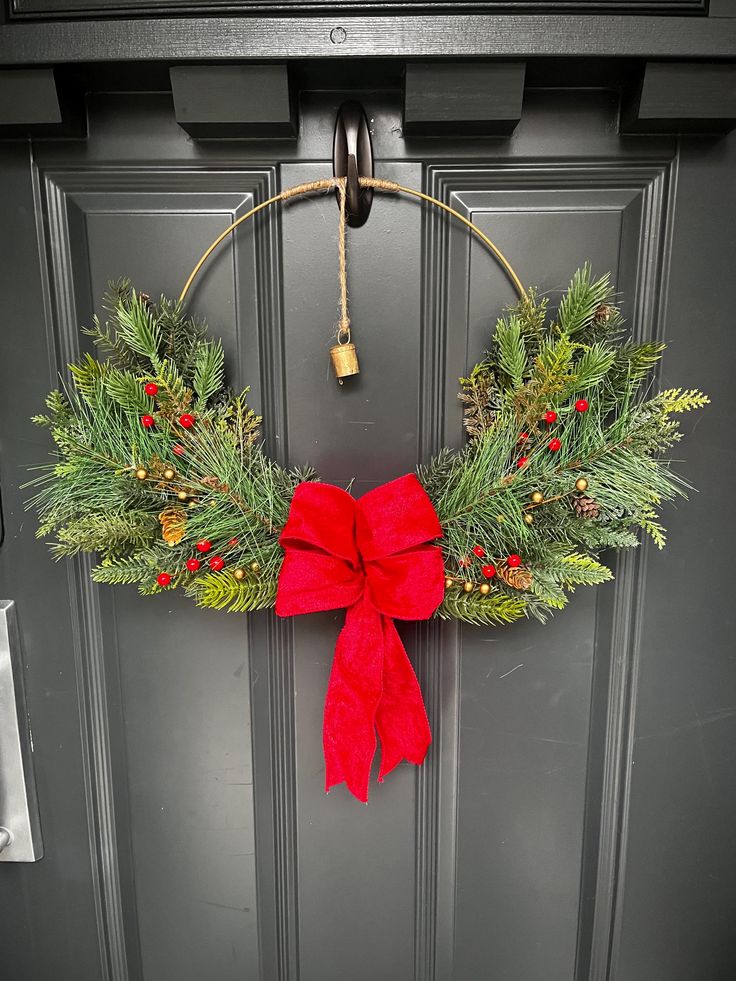 a christmas wreath hanging on the front door