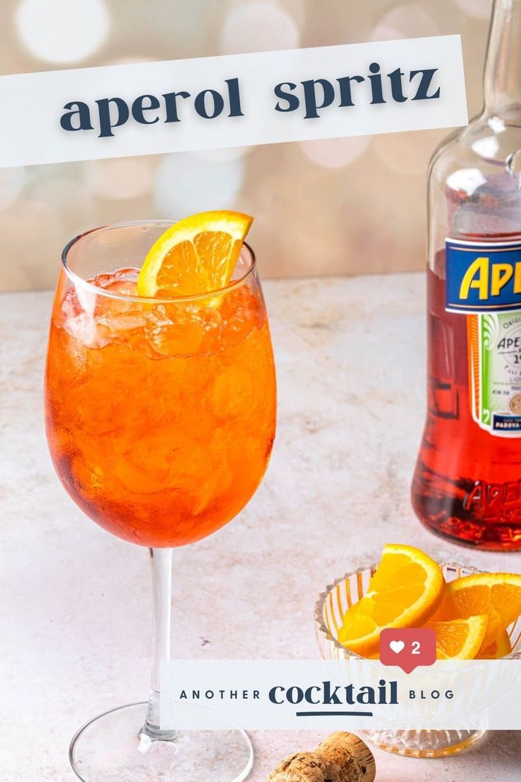 a bottle of aperol spritz next to a glass filled with orange juice