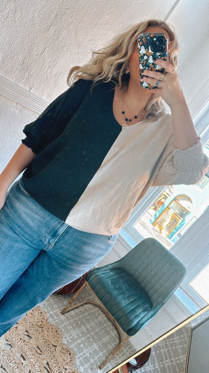 The best of both worlds! Our Next Level split blouse is trendy and oh-so cute! This unique airy top is featured in an oversized, slouchy fit with a split middle design and long balloon sleeves, creating an essential transitional piece. Style this piece effortlessly throughout the season! Neckline: v-neckline Fabric: 100% Polyester Airy fabrication Long sleeves Smocked wrist cuffs. Imported Fit: Oversized slouchy fit! generous room Model Specs: Syd is wearing a size Large in the photo.(Typical Sizing - Karli: S-Size 5/26 - 5ft 2in, Emily: S-Size 3/25 - 5ft 5in, Syd: L/XL- Size 15/ - 5ft 8in)Need help with sizing? No problem! Join our VIP group on Facebook, Everyday Chic Boutique VIP Insiders to chat directly with our team and other customers just like you.Packaged with love and shipped from Trendy V-neck Top With Blouson Sleeves, Trendy Oversized V-neck Blouse, Casual Long Sleeve Top With Balloon Sleeves, Casual Billowy V-neck Tops, Trendy Billowy Tops With Lantern Sleeves, Casual Lantern Sleeve Blouse For Day Out, Fall Oversized Tops With Blouson Sleeves, Relaxed Fit Tops With Blouson Balloon Sleeves, Casual Tops With Blouson Balloon Sleeves