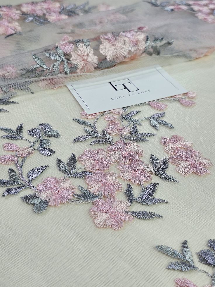 "Grey pink embroidered tulle lace fabric, bridal wedding lace, evening dress lace, by the yard. White delicate tulle fabric with grey/pink flower embroidery. Quantity available. Please \"Add to cart\" to see available quantity. Both sides scalloped. Width: 135 cm/53.1 inches Item number: LK87002 Made in Europe www.LaceToLove.com Price is set for one meter/yard.  You will receive the fabric in one continuous piece if you purchase more than 1 meter/yard. Actual color may vary greatly form the colo Elegant Pink Fabric With 3d Embroidery, Elegant Pink Embroidered Fabric With Floral Design, Elegant Embroidered Pink Lace, Elegant Pink Embroidered Lace, Elegant Pink Embroidered Fabric With Lace Work, Pink Tulle Fabric With 3d Embroidery For Wedding, Pink Embroidered Organza Fabric With Lace Work, Pink Wedding Tulle Fabric With 3d Embroidery, Elegant Pink Lace Tulle Fabric