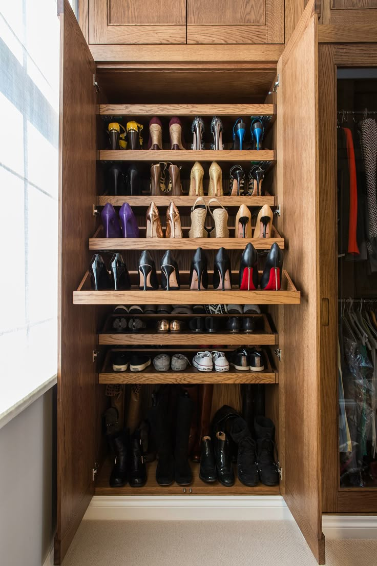 the closet is full of shoes and other things to wear in it's storage area