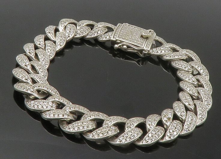 "925 Sterling Silver - Vintage Cubic Zirconia Curb Link Chain Bracelet - BT5605  925 Sterling Silver - Vintage Cubic Zirconia Curb Link Chain Bracelet - BT5605  Jewelry Type:         Bracelet   Metal Type:            925 Silver  Metal Size:             8.5\" Length  .50\" Height   Stone Type:            Cubic Zirconia   Condition:              N/A  Jewelry Weight:     58.2 Grams  PLEASE NOTE: THIS ITEM IS PRE-OWNED. ALTHOUGH MOST ITEMS ARE IN VERY GOOD CONDITION, SOME MAY NEED CLEANING AND/OR MINOR REPAIRS. WE MAKE A VERY STRONG EFFORT TO UPLOAD CLEAR PICTURES. PLEASE INSPECT ALL PICTURES AND ASK ALL QUESTIONS YOU MAY HAVE PRIOR TO MAKING A PURCHASE. NOT ALL STONES ARE GENUINE, SOME ARE ENHANCED OR CREATED." Silver Cubic Zirconia Chain Bracelet With Bling, Silver Diamond Chain Bracelets, Classic Silver Bracelets With Pave Setting, Classic Silver Bracelet With Pave Setting, Silver Chain Bracelet Fine Jewelry, Formal Silver Chain Bracelet With Pave Setting, Silver Diamond Chain Bracelet With Pave Setting, Silver Chain Bracelet With Pave Setting, Silver Iced Out Cubic Zirconia Chain Bracelet