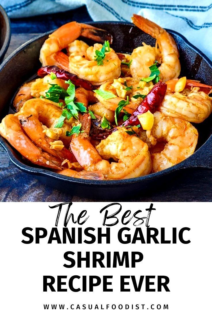 the best spanish garlic shrimp recipe ever in a cast iron skillet with text overlay