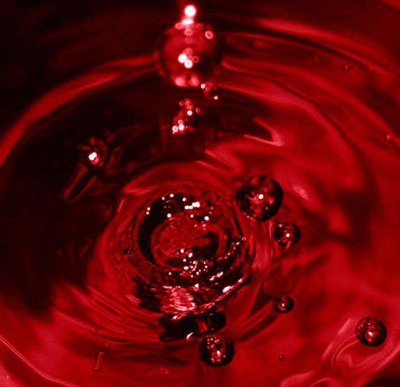 red water with bubbles floating in it