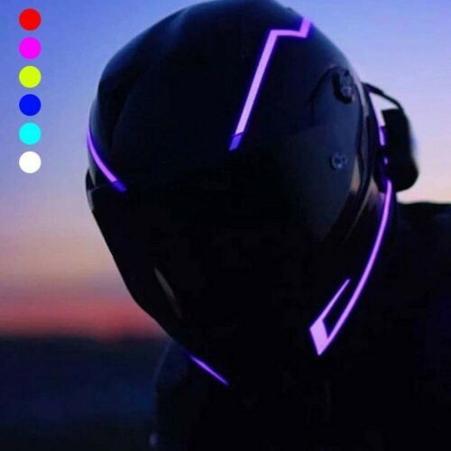 a person wearing a helmet and headphones with the sun setting in the back ground