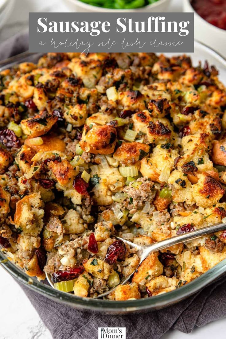 sausage stuffing in a casserole dish with a serving spoon