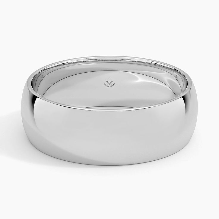 a white gold wedding ring on a white background