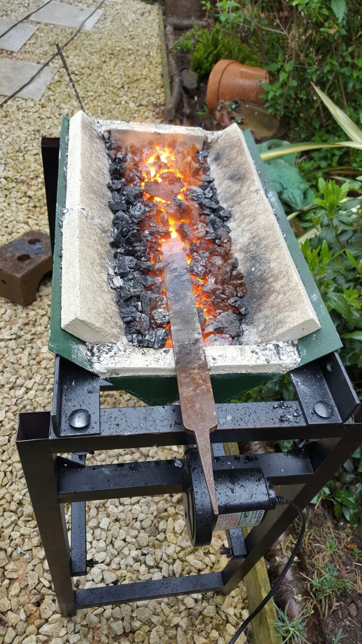 a large metal object with flames coming out of it