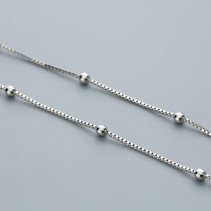 17.5 inch beaded sterling silver chain beaded with silver with clasp. Great chain alone or to add pendants to. Product Name: Sterling Silver Ball Bead Box Chain Main Material: 925 Sterling Silver Feature Three Times Rhodium plating, Lead and Nickel Free Size: 17.5" length This 17.5 inch beaded sterling silver chain beaded with silver is secured with clasp. Beaded Boxes, Sterling Silver Chain Necklace, Silver 925 Necklace, Crystal Charm, Box Chain, Beaded Chain, Sterling Silver Chain, Sterling Silver Chains, Sterling Silver Necklaces