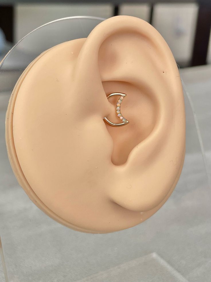 a fake ear with a diamond ring on it