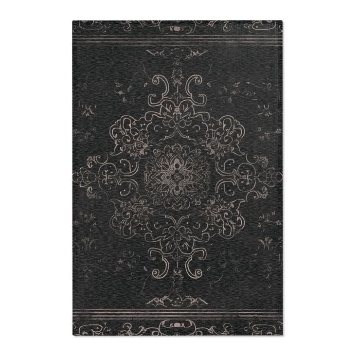 a black and white rug with an intricate design