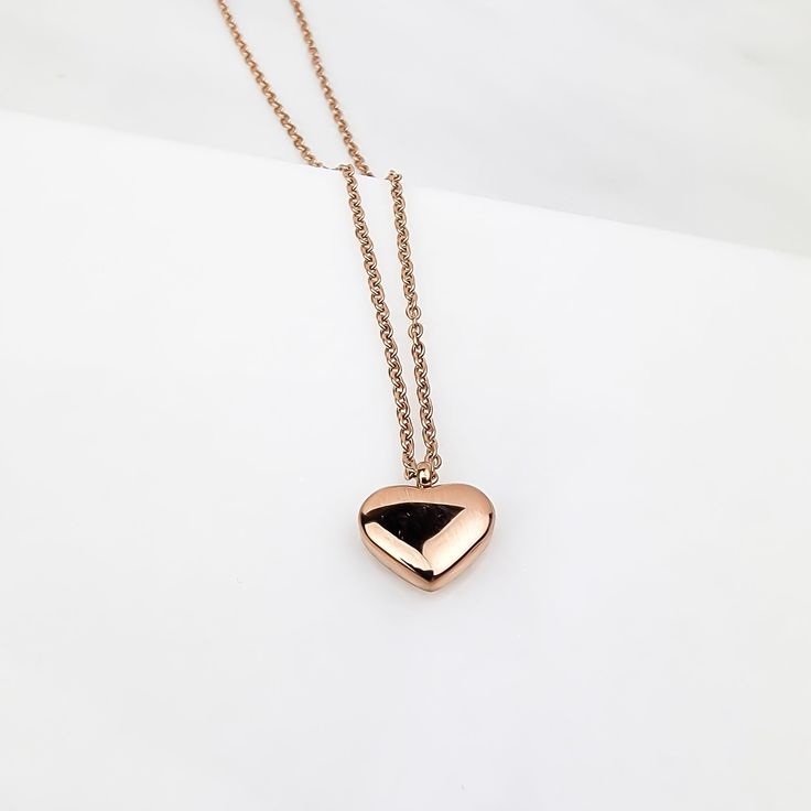 Charming with its lovely simplistic design, the My Full Heart Necklace will definitely bring smiles and create memories. What a great necklace to express love and admiration for the one that makes your heart beat special. Material: 18k Gold/18k Rose Gold plating over Stainless Steel Necklace length: 16 inches Pendant Shape: heart Nickel & Lead-free & Hypoallergenic Complimentary Gift Box Included Rose Gold Stainless Steel Charm Necklace For Valentine's Day, Rose Gold Heart Charm Necklace In Stainless Steel, Rose Gold Heart Pendant Necklace In Stainless Steel, Rose Gold Heart Necklace In Stainless Steel, Minimalist Rose Gold Charm Necklace For Anniversary, Anniversary Rose Gold Stainless Steel Charm Necklace, Dainty Rose Gold Heart Locket Necklace, Rose Gold Heart Pendant Locket Necklaces, Minimalist Rose Gold Heart Pendant Charm Necklace