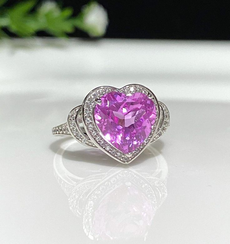 Vintage Sterling Silver Pink Sapphire & White Topaz Heart Ring....Marked 925...Total of weights 3.6gramsMeasure of stone center 9.5MM...It's in very good condition. Valentine's Day Heart Cut Amethyst Ring, Valentine's Day Sterling Silver Diamond Ring With Gemstone, Heart-shaped Cubic Zirconia Ring With Accent Stones, Sterling Silver Heart Cut Sapphire Ring, Cubic Zirconia Heart-shaped Gemstone Ring, Gemstone Heart Ring With Cubic Zirconia, Valentine's Day Heart Cut Amethyst Ring In Sterling Silver, Silver Sapphire Heart Cut Ring, Silver Heart Cut Sapphire Gemstone Ring