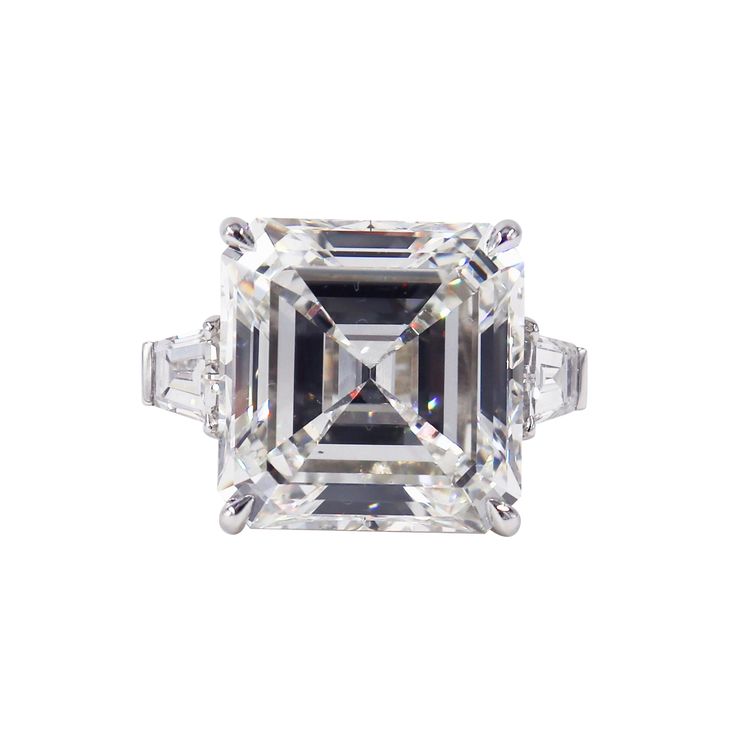 A truly spectacular piece featuring a treasure from the J. Birnbach vault. This magnificent ring features a 21.13 carat GIA certified Asscher cut of H color and VS1 clarity. Tapered baguettes are a timeless accent to the center diamond-this pair totals approximately 1.50 carats. The ring is crafted in platinum, and destined to be an heirloom piece beloved for generations. Custom engraving and sizing available. Bold Engagement Rings, Ascher Cut, Radiant Cut Diamond Ring, Diamond Engagement Rings Cushion, Cushion Diamond Ring, Brilliant Cut Diamond Ring, Pear Diamond Engagement Ring, Jewelry Rendering, Contemporary Engagement Rings