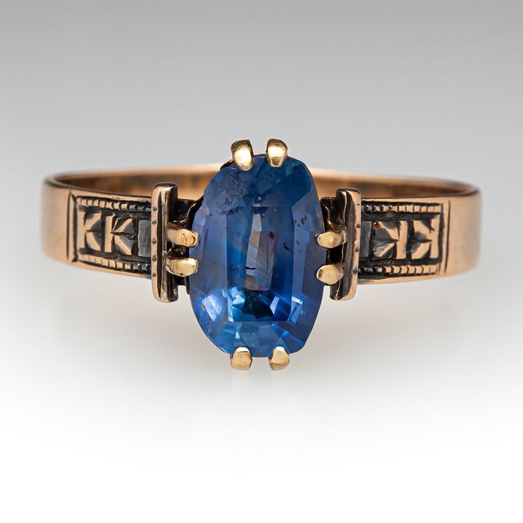 This beautiful circa late-Victorian ring contains one (1) cushion mixed cut natural sapphire weighing 1.92 carats and set into a four-split prong head. Engraved details accent the shoulders of the shank. The ring measures 10.2mm at the top, rises 4.0mm above the finger, tapering to 3.4mm wide and 0.6mm thick at the base of the shank. The ring is currently size 7.5 and has a nice aged patina. Antique Oval Sapphire Ring With Rose Cut Diamonds, Heirloom Cushion Cut Sapphire Ring, Antique Sapphire Ring With 17 Jewels, Antique Oval Sapphire Ring, Victorian Oval Sapphire Ring With Center Stone, Heirloom Cushion Cut Sapphire Ring With Center Stone, Heirloom Sapphire Ring With Cushion Cut Center Stone, Heirloom Sapphire Birthstone Ring, Victorian Style Oval Sapphire Ring