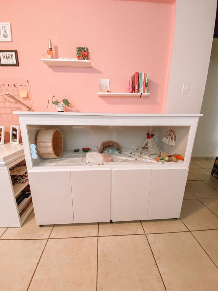 a white cabinet sitting in the corner of a room