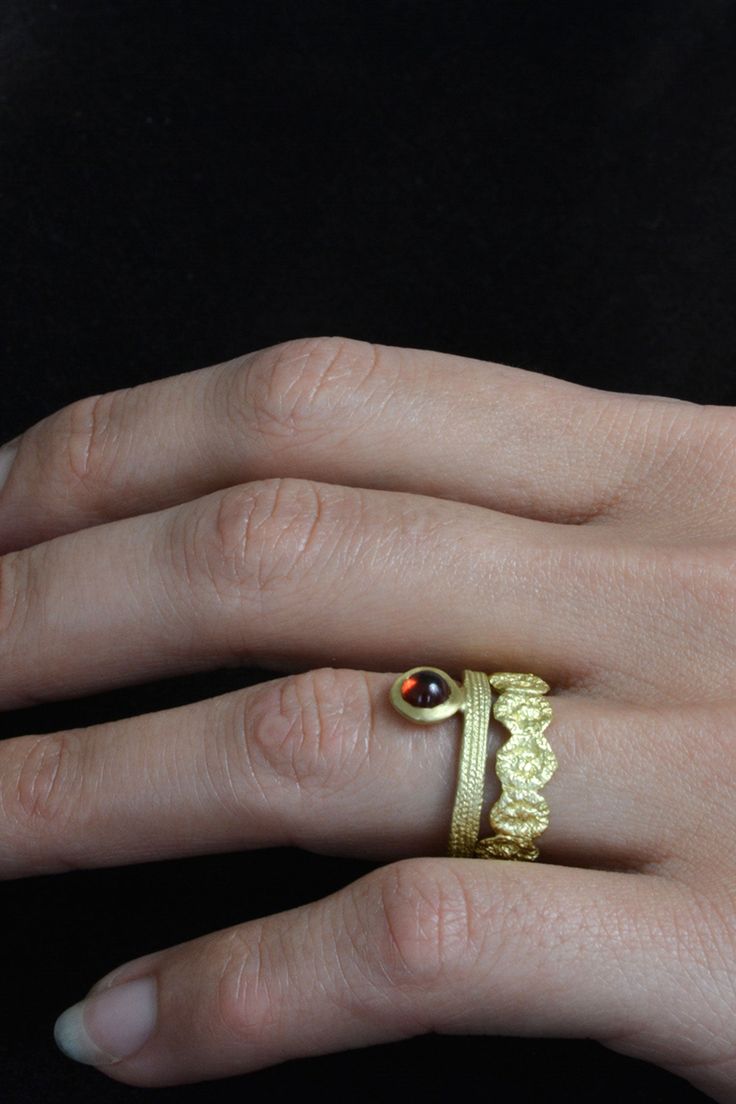 Hand-forged gold band in a cypress flower motif, stands sophisticated on it's own, and pairs beautifully with more delicate sticking bands. WHY WE LOVE IT Seattle based fine jewelry designer Francesca Lacagnina began her creative life in the 70’s. Born in Italy, her family exposed her from a young age to great cities of antiquity – which cultivated the rich visual language she would later express through her design aesthetic. She is committed to ethical standards which is why the line is compris Elegant Hammered Rings, Elegant Hand Forged Yellow Gold Rings, Elegant Hammered Ring Jewelry, Heirloom Hand Set Yellow Gold Jewelry, Luxury Hammered Jewelry For Weddings, Hand Forged Brass Wedding Jewelry, Ceremonial Hammered Yellow Gold Jewelry, Ceremonial Yellow Gold Hammered Jewelry, Elegant 22k Gold Ceremonial Rings