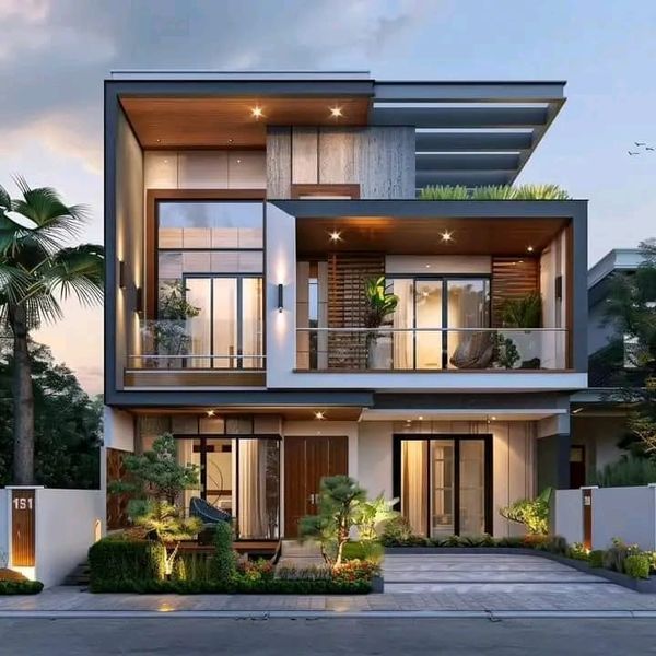 this is an image of a modern house at night with lights on the balconies