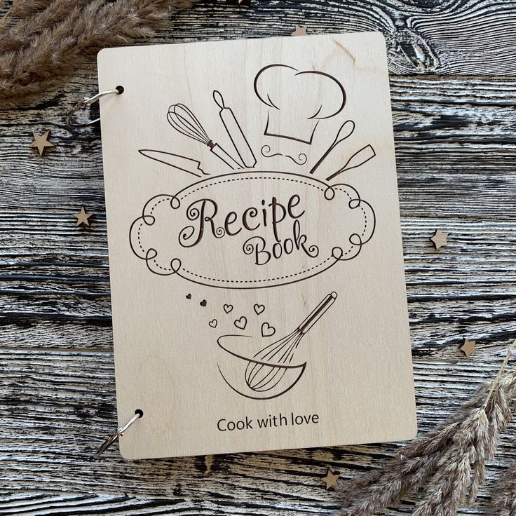 a wooden recipe book sitting on top of a table