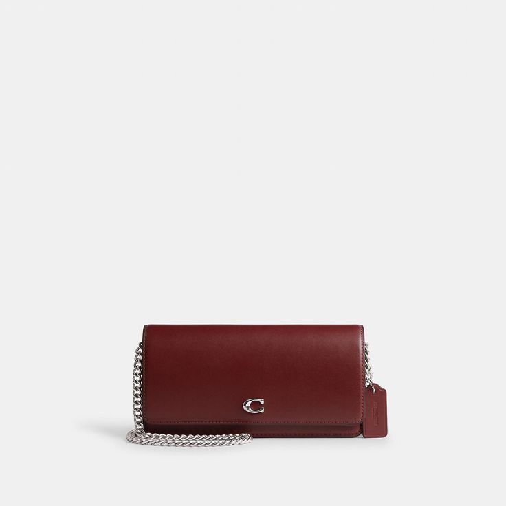 Form function and craftsmanship combine on our refined leather Evie Long Wallet. Detailed with our Signature hardware it has a convenient outside pocket and a spacious interior with multiple card slots a billfold compartment and a zip pocket for coins plus space for the largest size phone. Toss in a bag carry as a clutch or wear crossbody with the detachable gleaming chain strap. | Coach Evie Long Wallet With Chain - Women's Designer Crossbody - Silver/dark Ruby Wallet With Chain, Wallet On Chain, Honey Brown, Designer Crossbody, Signature Hardware, Wallet Chain, Long Wallet, Chain Strap, A Bag