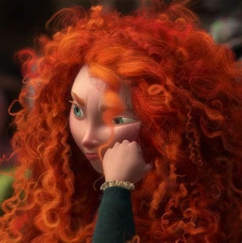 a close up of a doll with red hair