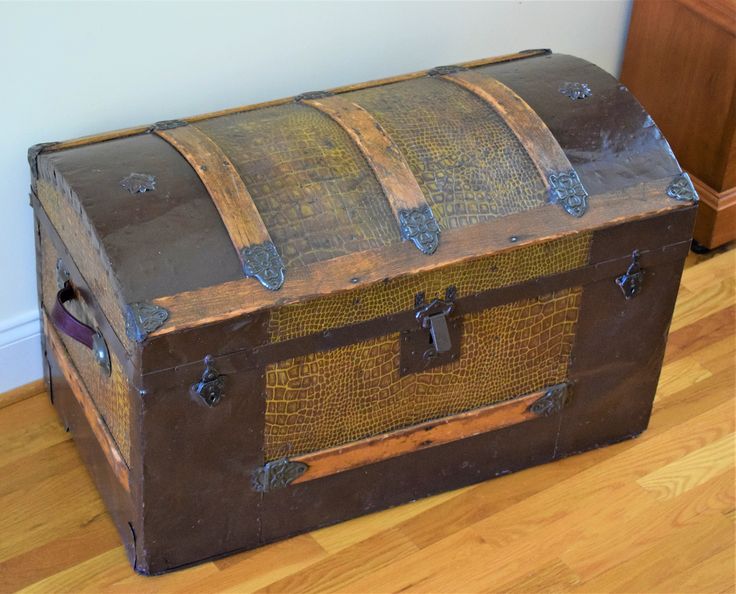 an old trunk is sitting on the floor