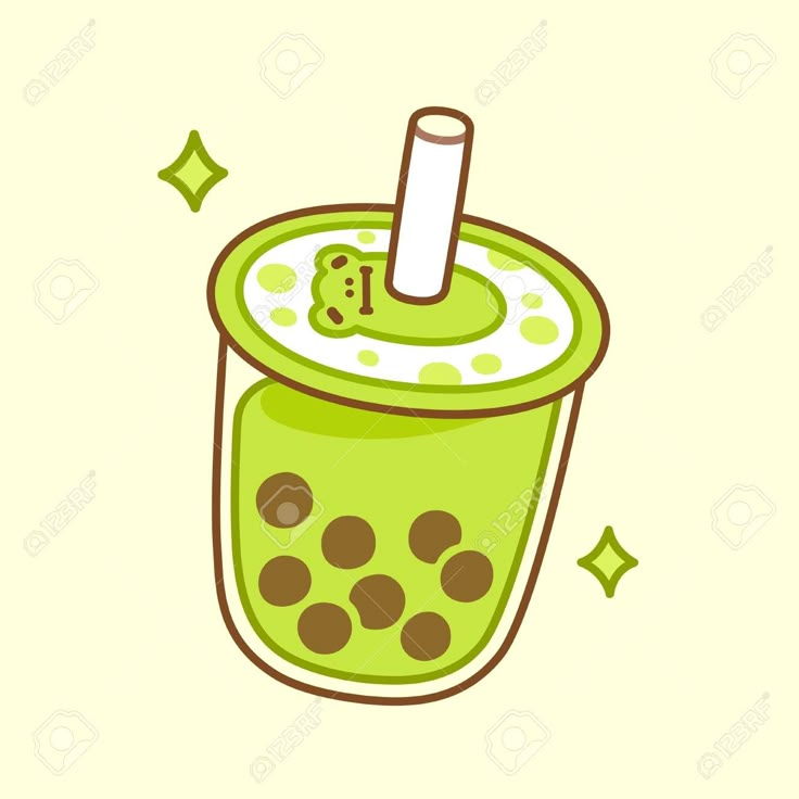 a green drink in a glass with a straw and polka dot pattern on the rim