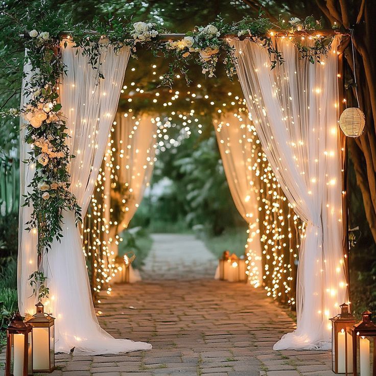 an archway decorated with lights and greenery