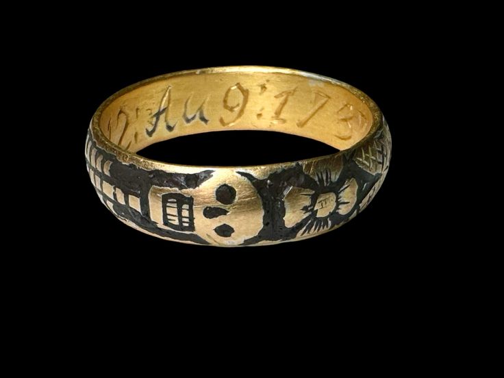 A Memento Mory gold and black enamel ring is also called a skeleton ring.Memento mori is a Latin phrase meaning 'remember you must die'. Finished in black enamel (niello) on the background, the skeleton is depicted around the whole surface of the ring and Fowler is behind the skull. An inscription on the inner band read: G. G.M.12:AUG:1737:AET 66: Circa 17th. Century Ad. Measurements: 18.2 mm., 5.19 grams. CONDITION Very good, with some light wear to the gold commensurate with age and use. Overa Collectible Symbolic Black Skull Ring, Memento Mori Ring, Memento Mori Jewelry, Skeleton Ring, Phrase Meaning, Painting Embroidery, Future Outfit, The Skeleton, A Skeleton