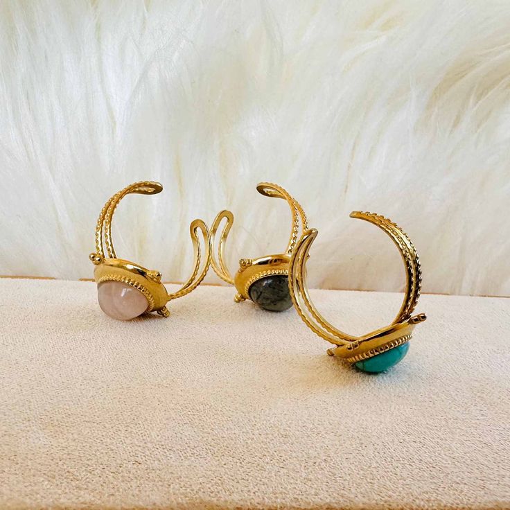 Bring some mystical vibes to your style with Earth Spirit Gem Rings! With their boho retro look, they'll add a little something special to any outfit. 🤩 And just look at those magical gems—they'll keep your spirit grounded, no matter how high your style game goes! 🤩✨ Each ring is adjustable, ensuring a perfect fit no matter the size of your finger. Slip one on and accessorize your look with a touch of classic, bohemian chic! 🥰 ✓ Material: Stainless Steel✓ Gemstone: turquoise, rose quartz, gre Adjustable Bohemian Crystal Ring With Ethical Gemstones, Bohemian Adjustable Crystal Ring With Gemstone Accents, Bohemian Adjustable Crystal Ring With Gemstone, Bohemian Adjustable Crystal Ring For Gifts, Bohemian Adjustable Crystal Ring Gift, Bohemian Adjustable Crystal Ring As Gift, Adjustable Magical Gemstone Rings, Spiritual Adjustable Gemstone Midi Rings, Adjustable Spiritual Gemstone Midi Rings