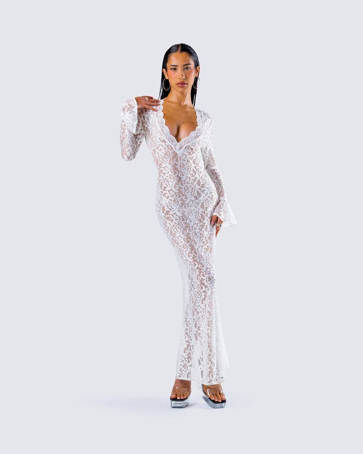 The type of dress that will have them thinking about you forever ☁️ give them something to remember in this white lace maxi dress. Complete with a deep V neckline, long sleeves, a mermaid skirt, and a ruffled sleeve hem 🕊️ Leave little to the imagination -- 'dress' is sheer & undergarments are not included 👀 White Maxi Dress With Scalloped Lace V-neck, V-neck Maxi Dress With Scalloped Lace For Party, Party V-neck Maxi Dress With Lace Sleeves, Long Sleeve Maxi Dress With Scalloped Lace For Parties, V-neck Maxi Dress With Lace Sleeves For Party, Long Sleeve Scalloped Lace Maxi Dress For Party, White Long Sleeve Maxi Dress For Date Night, Chic White Maxi Dress With Scalloped Lace, White Maxi Dress With Scalloped Lace For Evening