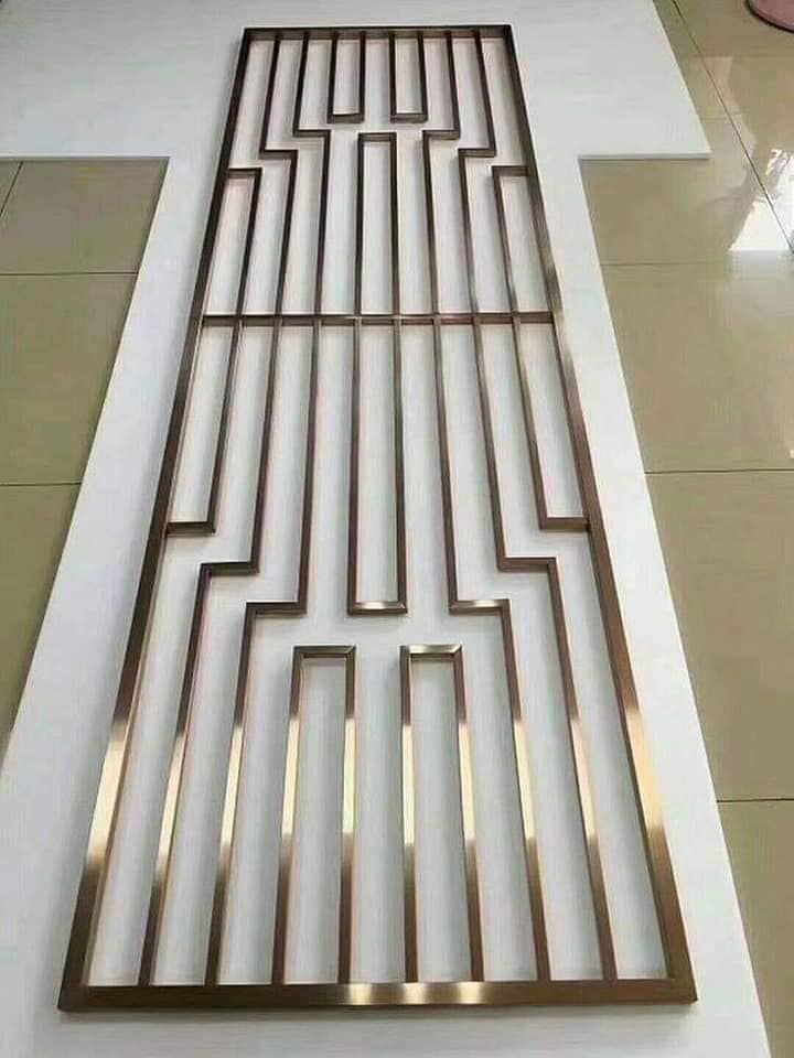 a metal grate sitting on top of a tiled floor next to a white wall