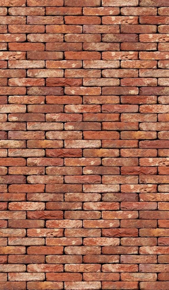 a red brick wall that is very close to the ground