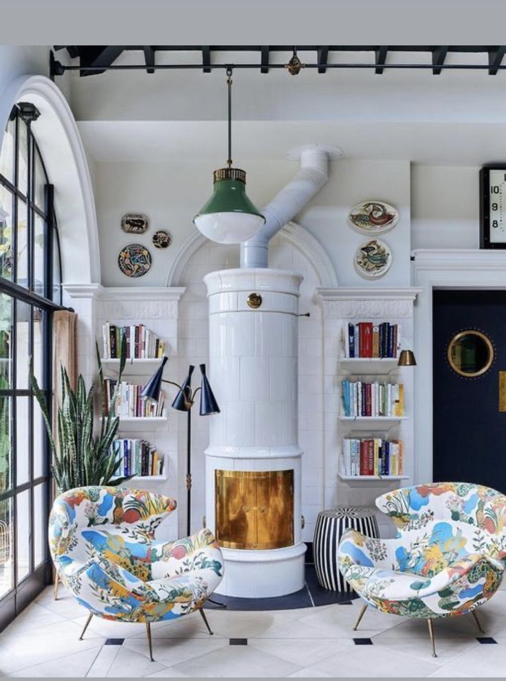 a living room filled with furniture and a fire place